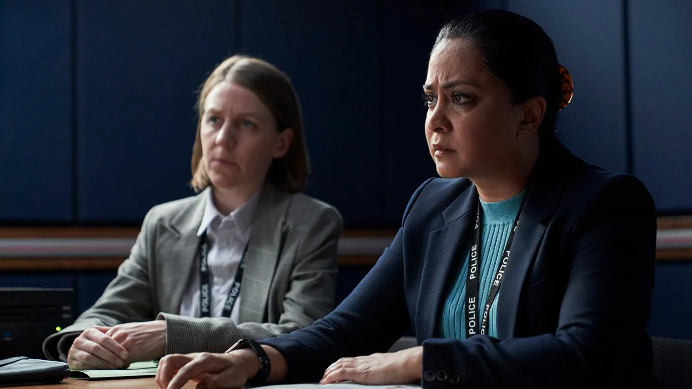 DI Ray sits in an interrogation room next to Henderson