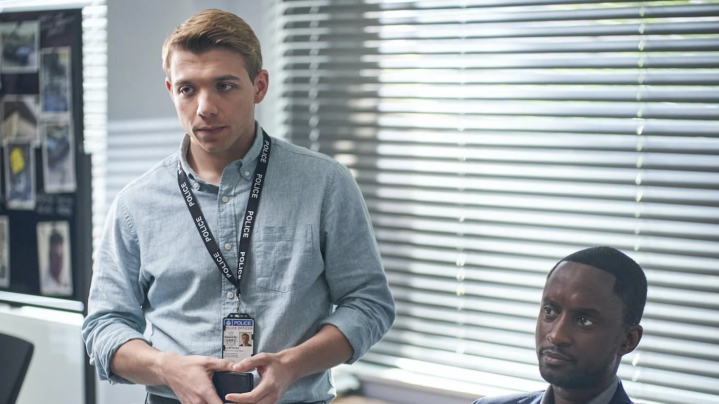 Liam and Kwesi in an office